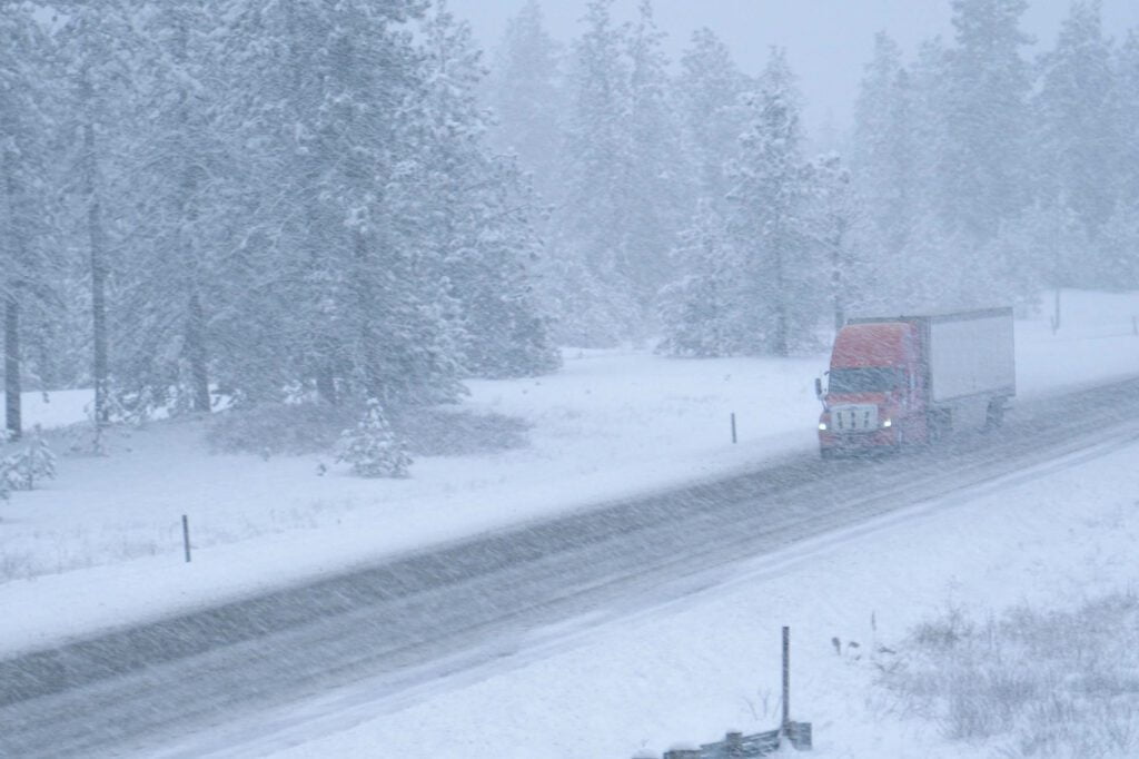The Top 10 Snowiest Cities in the US: Syracuse is #1 6 truck driving in a winter storm