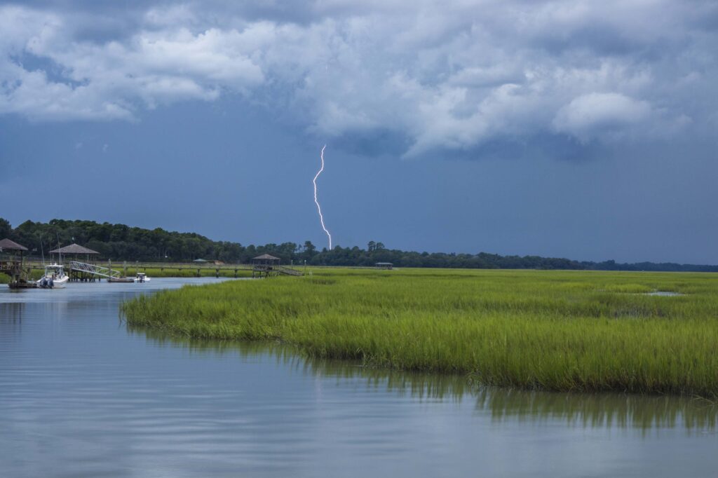 Best Lightning Detectors: Stay Safe in Severe Weather 2 lightning in the distance over water
