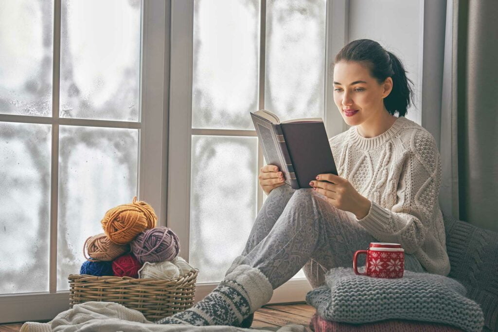 25 Great Weather Gift Ideas to Shop For This Black Friday 13 reading book by snowy window
